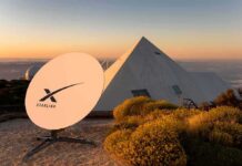 Europe’s Nerve Center Torched – Hybrid War Hits Starlink Starlink satellite dish near a pyramid-shaped building at sunset
