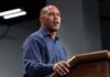 Hakeem Jeffries speaking at a podium