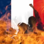 Racist Terror Label – Macron’s “First-Ever” Claim Sparks Fury silhouetted crowd and flames before a French flag