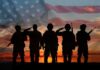 Soldiers Begged – Help Never Came Soldiers saluting at sunset with American flag overlay