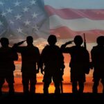 Soldiers saluting at sunset with American flag overlay