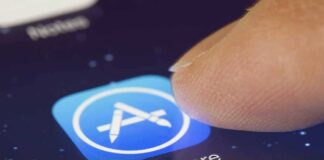 Finger tapping App Store icon on a smartphone screen