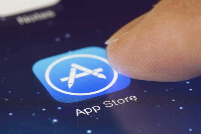 shutterstock_250627222 Finger tapping App Store icon on a smartphone screen