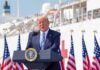 Navy Deadlines Loom – Trump Goes All-In Donald Trump speaking at a podium with American flags and a ship in the background
