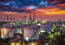 Hormuz Shutdown GUTS Qatar’s Cash Oil refinery with storage tanks at sunset