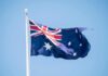 Deliberate Crash Stuns Australia’s Politics – Court Hears Chilling Attack Australian flag waving on a flagpole
