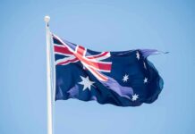 Deliberate Crash Stuns Australia’s Politics – Court Hears Chilling Attack Australian flag waving on a flagpole