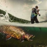 AI Fish Hoax – Clout Chasers Rig The Waters angler fighting a large fish in a split-level water shot
